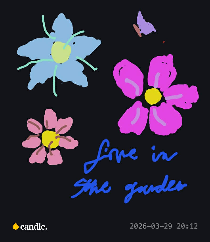 Three colorful flowers with blue handwritten note.